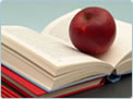 Photo of an apple on a book